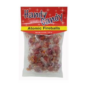 A 4.5 oz (127 g) package of Handy Candy ATOMIC FIREBALLS with round, red, individually wrapped candies in red and yellow packaging with white stars and the product name displayed.