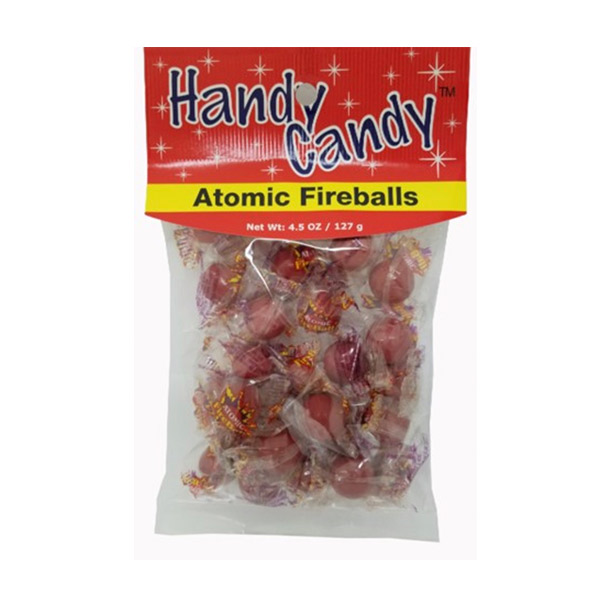 A 4.5 oz (127 g) package of Handy Candy ATOMIC FIREBALLS with round, red, individually wrapped candies in red and yellow packaging with white stars and the product name displayed.