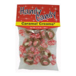 A bag of Handy Candy CARAMEL CREAMS contains individually wrapped caramel candies with white centers in clear wrappers and red labels, packaged with a red and yellow label at the top.