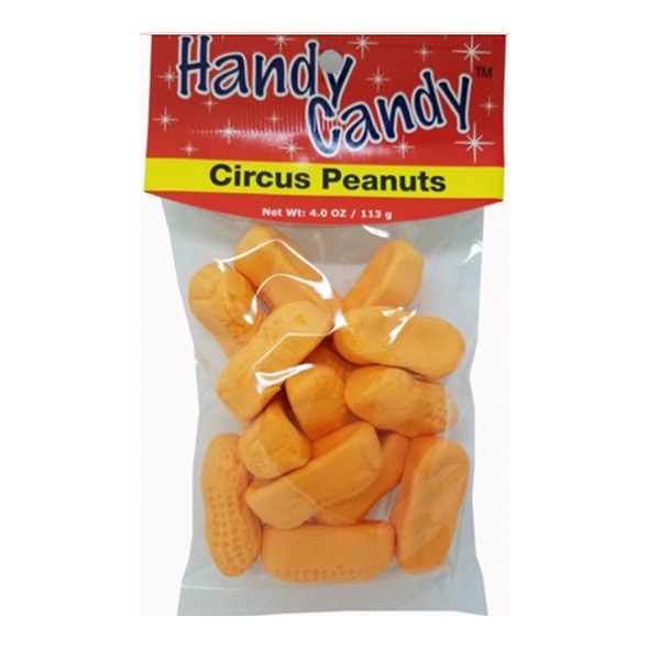 A clear bag labeled Handy Candy CIRCUS PEANUTS holds orange, peanut-shaped marshmallow candies. Red packaging with white stars and text. Net weight: 4.0 oz (113 g).